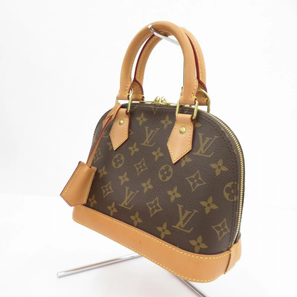 LOUIS VUITTON Alma Monogram Handbag Brown
